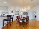 Spacious dining area featuring hardwood floors and a formal dining set at 110 Coleman St, Edgewater, FL 32141