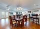Bright dining room with hardwood floors and a large wooden table at 110 Coleman St, Edgewater, FL 32141