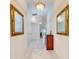 Bright entryway with tile flooring, ornate mirrors, and a wood dresser at 110 Coleman St, Edgewater, FL 32141