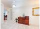 Bright entryway with tile floors and wooden dresser at 110 Coleman St, Edgewater, FL 32141