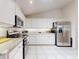 Modern kitchen featuring stainless steel appliances and white cabinetry at 110 Coleman St, Edgewater, FL 32141