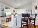 Kitchen with white cabinets, granite countertops, and stainless steel appliances at 110 Coleman St, Edgewater, FL 32141