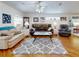 Relaxing living room featuring hardwood floors, neutral decor, and ceiling fan at 110 Coleman St, Edgewater, FL 32141