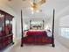 Main bedroom with a large four poster bed and plenty of closet space at 110 Coleman St, Edgewater, FL 32141