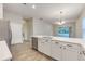 Spacious kitchen with island, stainless steel appliances, and white cabinets at 1175 Chessington Cir, Lake Mary, FL 32746