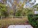 Private backyard with a wooden fence and a natural wooded area at 1542 Travertine Ter, Sanford, FL 32771