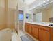 Elegant bathroom with double vanity, soaking tub, and separate shower at 1542 Travertine Ter, Sanford, FL 32771