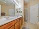 Spa-like bathroom with double sinks, a shower, and updated fixtures at 1542 Travertine Ter, Sanford, FL 32771