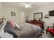 Bright bedroom featuring a comfortable bed and ample dresser space at 1542 Travertine Ter, Sanford, FL 32771