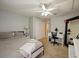 Spacious bedroom with a large bed, desk, and ample closet space at 1542 Travertine Ter, Sanford, FL 32771