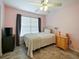 Bright bedroom featuring a comfortable bed and plenty of natural light at 1542 Travertine Ter, Sanford, FL 32771