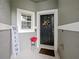 Welcoming front entry with decorative wreath and seasonal planter at 1542 Travertine Ter, Sanford, FL 32771