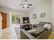 Relaxing living room with a sectional sofa and access to backyard at 1542 Travertine Ter, Sanford, FL 32771