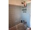 Bathroom with shower and tiled walls at 1701 N Hastings St, Orlando, FL 32808