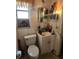 Small bathroom with a toilet, sink, and medicine cabinet at 1701 N Hastings St, Orlando, FL 32808