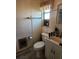 Clean bathroom with toilet, sink, and shower at 1701 N Hastings St, Orlando, FL 32808