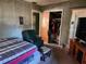 Comfortable bedroom with a double bed, armchair, and spacious closet at 1701 N Hastings St, Orlando, FL 32808