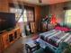 Relaxing bedroom with a double bed, wooden furniture, and large window at 1701 N Hastings St, Orlando, FL 32808