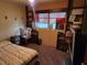 Bedroom with double bed and built-in shelving at 1701 N Hastings St, Orlando, FL 32808