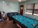 Pool table and couch in a game room at 1701 N Hastings St, Orlando, FL 32808