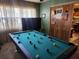 Game room features a pool table and large TV at 1701 N Hastings St, Orlando, FL 32808