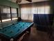 Game room with pool table and large TV at 1701 N Hastings St, Orlando, FL 32808