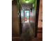 Long hallway with doors to bedrooms and bathroom at 1701 N Hastings St, Orlando, FL 32808