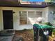 White house with a dark door and large window at 1701 N Hastings St, Orlando, FL 32808