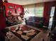 Bright living room with brown couches and large windows at 1701 N Hastings St, Orlando, FL 32808