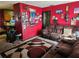 Living room features brown couches and a large TV at 1701 N Hastings St, Orlando, FL 32808