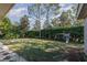 Fenced backyard with grassy area and playset at 25628 Hawks Run Ln, Sorrento, FL 32776