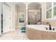 Spa-like bathroom with a soaking tub and separate shower at 25628 Hawks Run Ln, Sorrento, FL 32776
