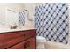Clean bathroom with a shower/tub combo and updated vanity at 25628 Hawks Run Ln, Sorrento, FL 32776