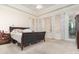 Spacious Primary bedroom with ample natural light and plush carpeting at 25628 Hawks Run Ln, Sorrento, FL 32776