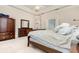 Comfortable bedroom featuring a large bed and built-in wardrobe at 25628 Hawks Run Ln, Sorrento, FL 32776