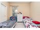 Two twin beds, dresser, and window coverings in a spacious bedroom at 25628 Hawks Run Ln, Sorrento, FL 32776