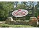 RedTail community sign in front of stone pillars at 25628 Hawks Run Ln, Sorrento, FL 32776
