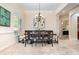 Bright dining room featuring a spacious table with six chairs and large windows at 25628 Hawks Run Ln, Sorrento, FL 32776