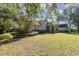 House exterior with manicured lawn and landscaping at 25628 Hawks Run Ln, Sorrento, FL 32776