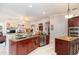 Modern kitchen with stainless steel appliances and an island at 25628 Hawks Run Ln, Sorrento, FL 32776