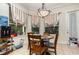 Bright breakfast nook with a small table and four chairs at 25628 Hawks Run Ln, Sorrento, FL 32776
