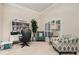 Home office with built-in shelving, comfortable seating, and natural light at 25628 Hawks Run Ln, Sorrento, FL 32776