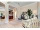Bright office with built-ins, comfortable seating, and large windows at 25628 Hawks Run Ln, Sorrento, FL 32776