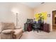 Functional home office featuring a large desk and comfortable chair at 25628 Hawks Run Ln, Sorrento, FL 32776