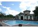 Resort-style pool with lounge chairs and landscaping at 25628 Hawks Run Ln, Sorrento, FL 32776