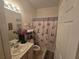 Bathroom with tub shower and updated vanity at 501 Heritage Trail St, Kissimmee, FL 34759
