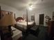 Spacious bedroom with a post bed, ample closet space, and an ensuite bathroom at 501 Heritage Trail St, Kissimmee, FL 34759
