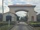 Gated community entrance with guardhouse at 501 Heritage Trail St, Kissimmee, FL 34759