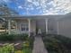 Front porch with rocking chairs and brick walkway at 501 Heritage Trail St, Kissimmee, FL 34759