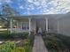 Front porch with rocking chairs and brick walkway at 501 Heritage Trail St, Kissimmee, FL 34759